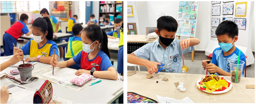 Children wearing face masks do art activities at tables, painting on the left and crafting with scissors on the right.
